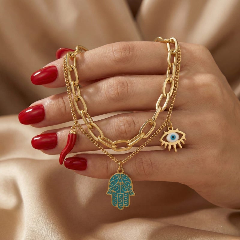 A gold bracelet made of rust-resistant stainless steel, with a design that combines blue palm, eye, and attractive red pepper charms, with an adjustable clasp to suit you. - Image 3